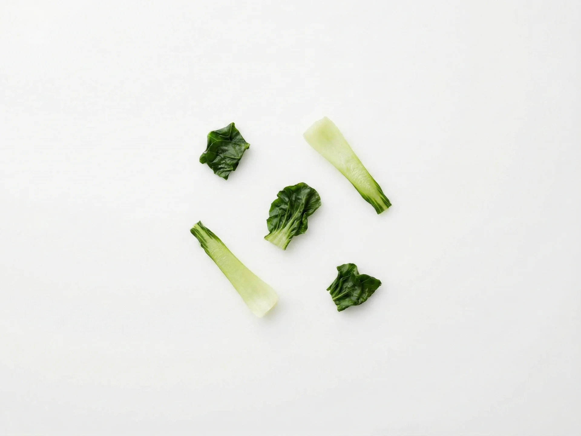 For babies 9-12 months, cook bok choy until soft but with slightly more texture to encourage chewing practice. You can serve smaller pieces as their pincer grasp develops. Cut cooked leaves into bite-sized pieces (about pea-sized) and stems into thin, short strips that are easy to pick up and chew.