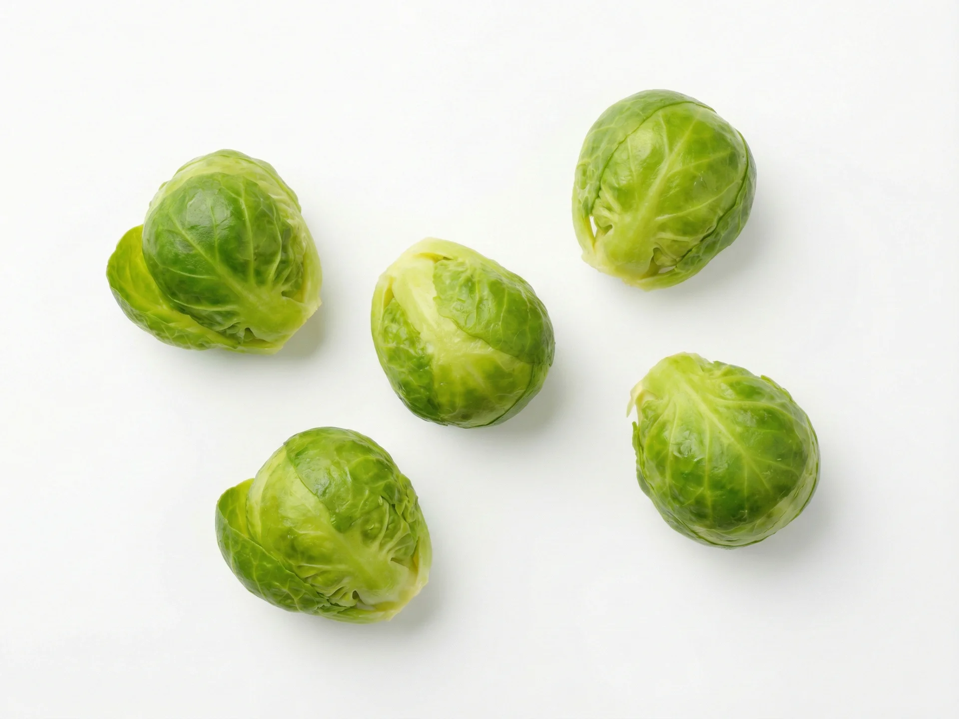 For babies 6-9 months, cook Brussels sprouts until very soft—steam or boil for 15-20 minutes until they mash easily. Mash or puree them to a smooth consistency, or offer large, soft florets that your baby can grasp and gum safely. Avoid adding salt or seasonings.