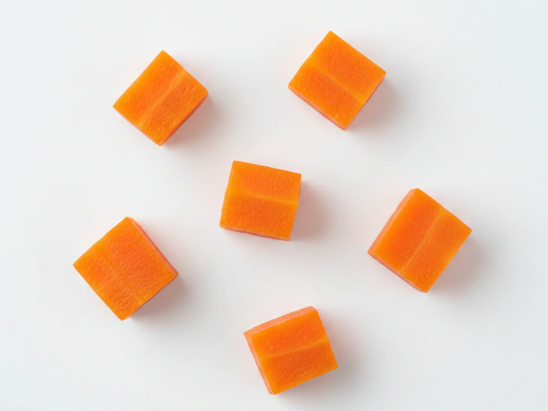 For 9-12 month olds, you can offer softer-cooked carrot pieces in bite-sized shapes as pincer grasp develops. Cook until soft but slightly firmer than for younger babies, and cut into small cubes or thin slices they can pick up independently.