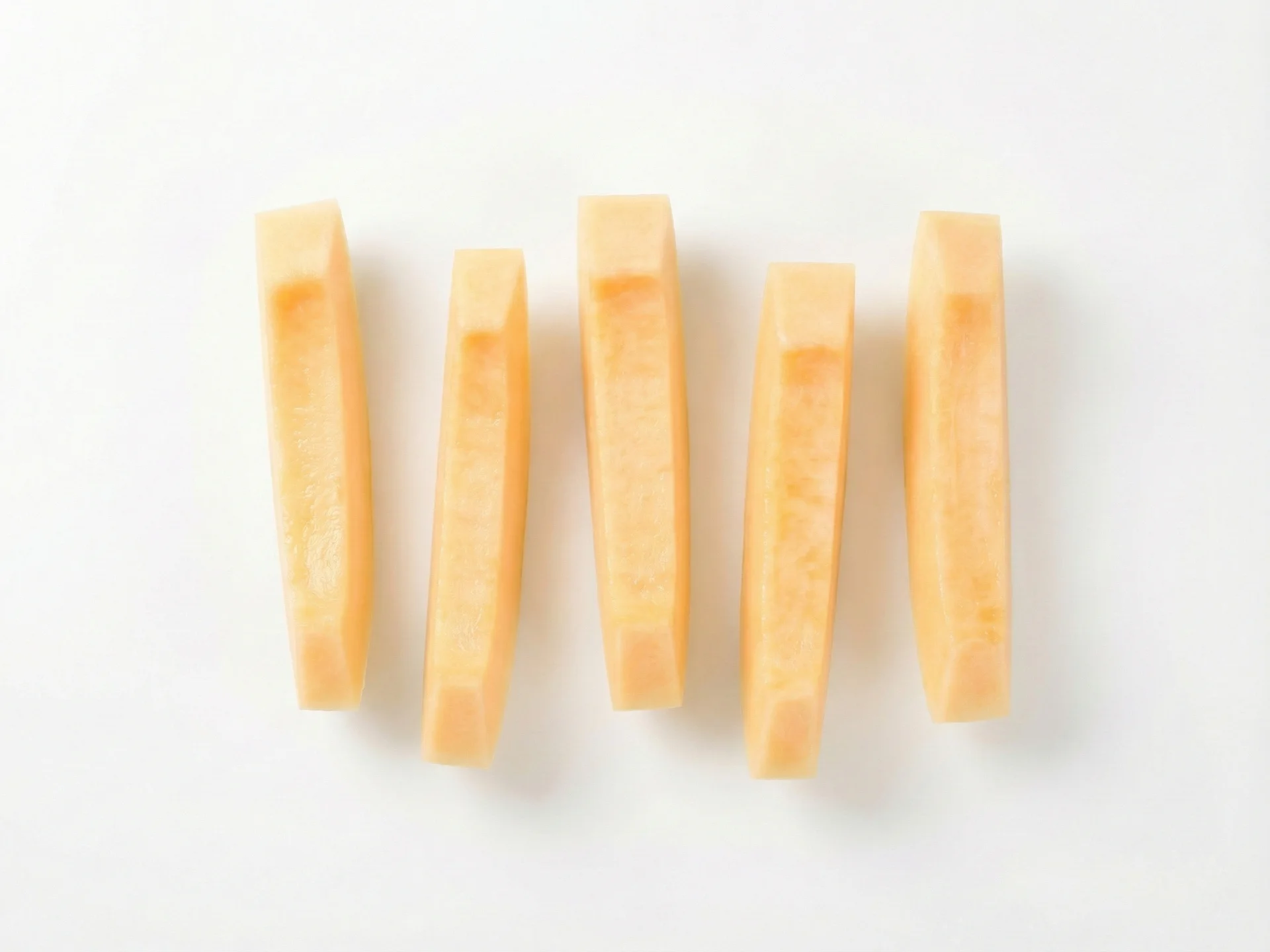 For babies 6-9 months, serve melon in large, rectangular strips about the size of two adult fingers. This allows your baby to grasp it easily and gnaw on the soft flesh without breaking off small pieces. Ensure the rind and all seeds are completely removed.