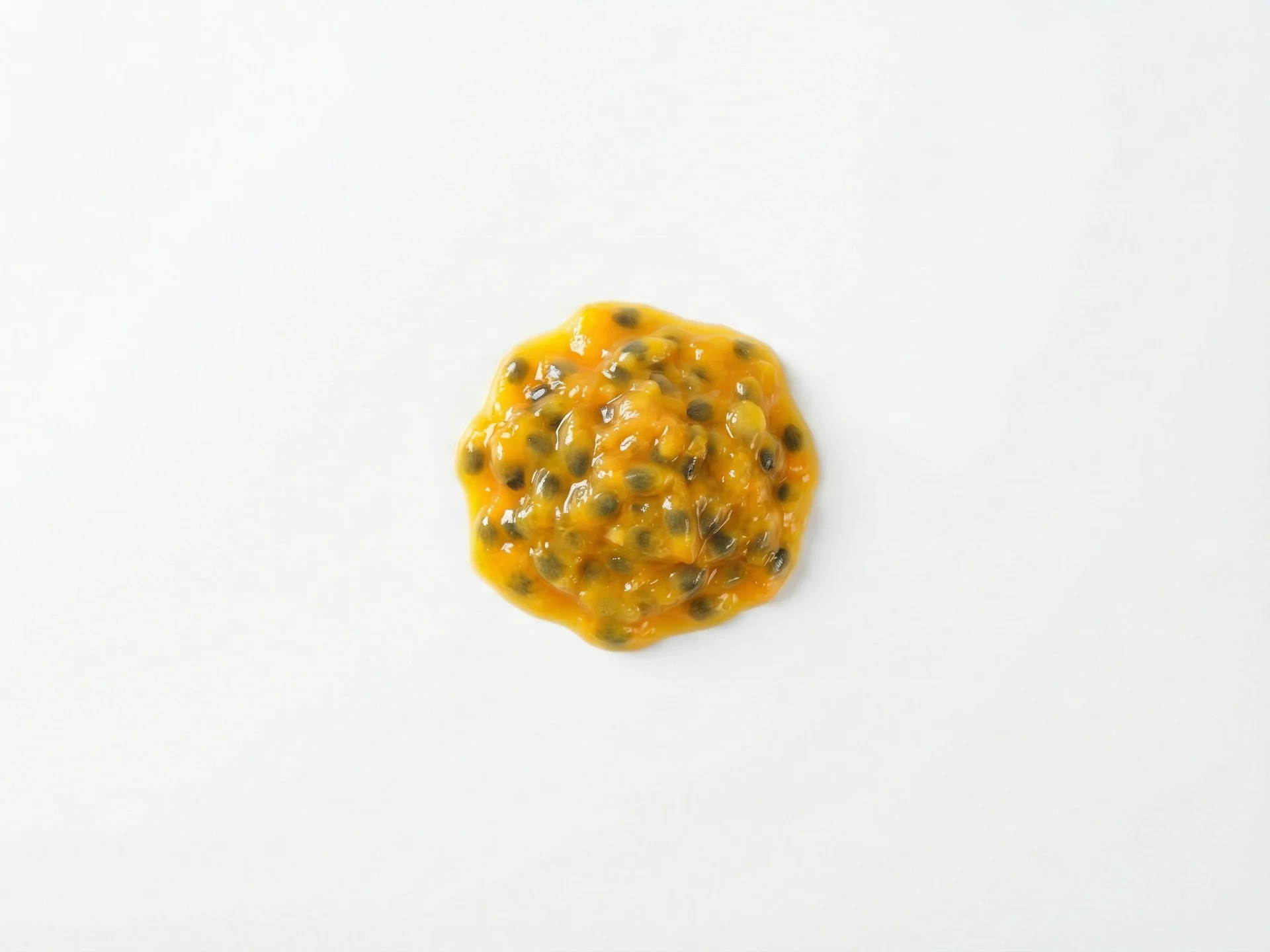 For babies 6-9 months, cut the passion fruit in half and scoop out the pulp into a small bowl. Mash it lightly with a fork to break up the seeds and create a smoother texture. Serve a small spoonful on a pre-loaded spoon or let your baby dip their fingers to explore the pulp.