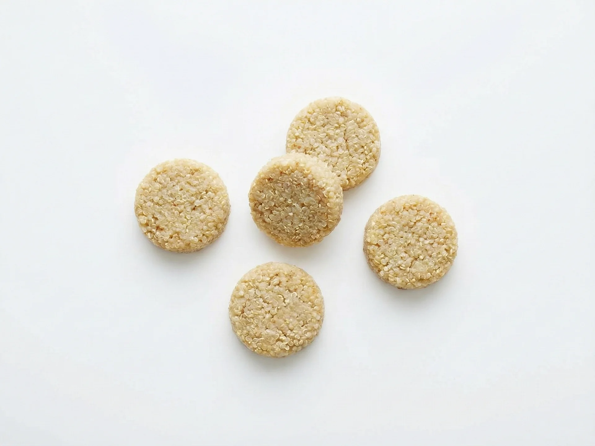 For babies 9-12 months, cook quinoa until tender but with more defined grains, and serve it as a finger food by forming it into small, soft patties or balls that are easy to pick up. You can also mix it with mashed vegetables, beans, or finely chopped herbs to add variety and encourage self-feeding skills.