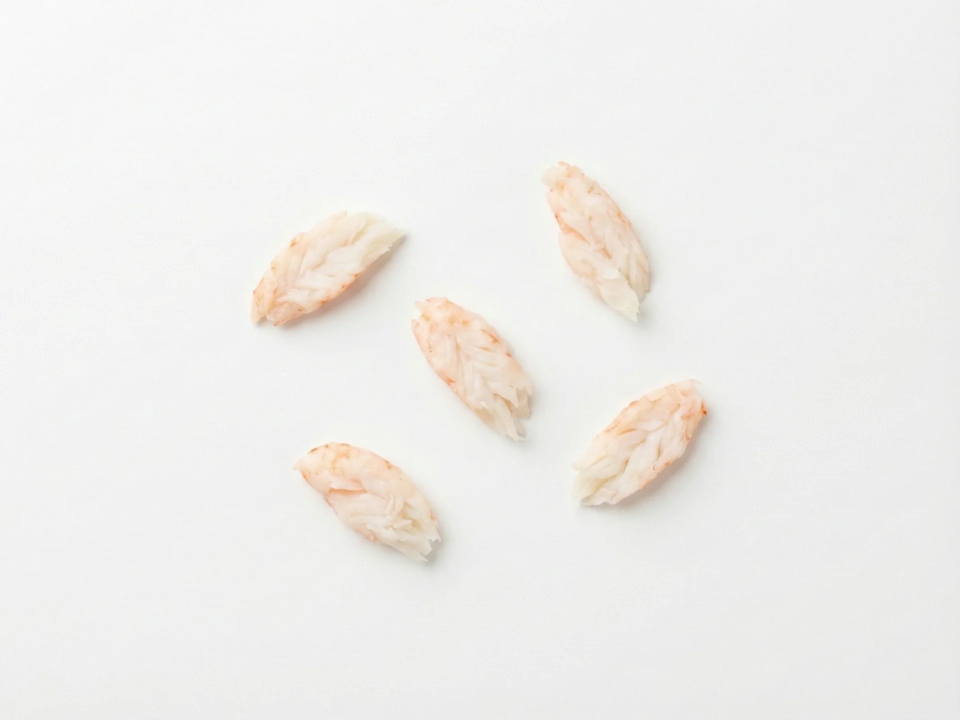 For babies 6-9 months, cook shrimp until fully opaque and tender, then cut into small, flattened pieces or shreds that are easy to grasp. Avoid round shapes that could pose a choking hazard. Steaming or boiling without salt is ideal to keep it soft and mild.